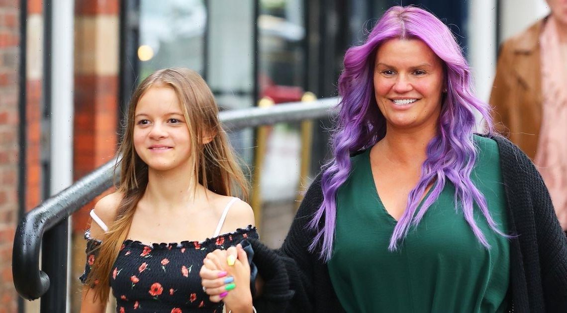 Kerry Katona shows off bright new purple hair as she steps out with daughter Heidi, 14