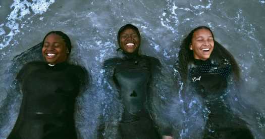 Waves of Joy: Capturing Black Surfers in Action