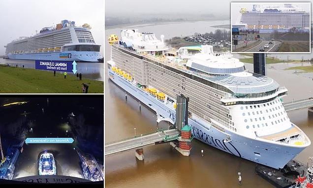 Video shows a cruise ship being pulled VERY carefully along a river