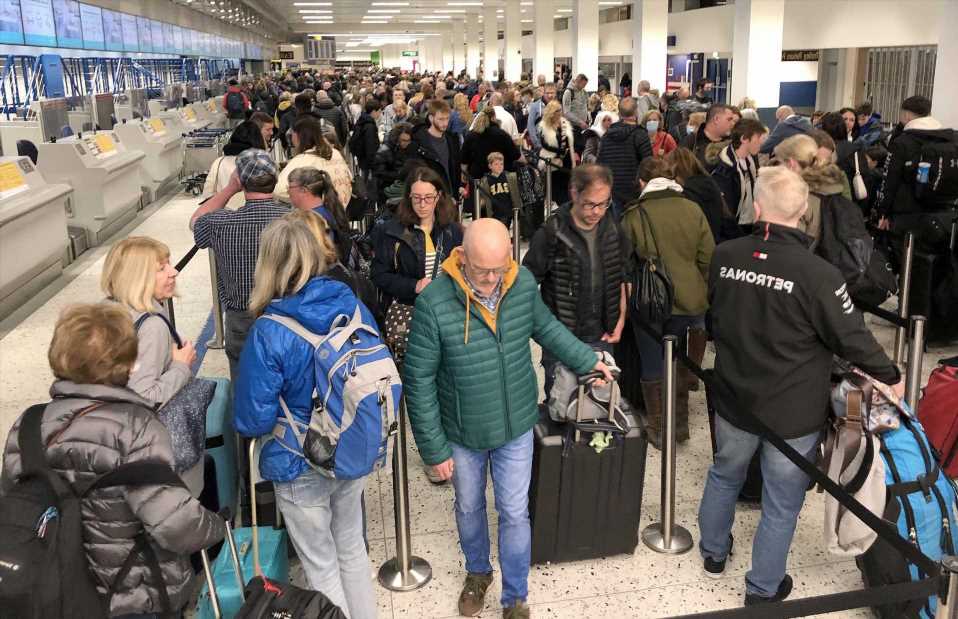 Airlines cancel dozens of flights AGAIN as desperate passengers arrive 12 HOURS early to airports amid travel chaos