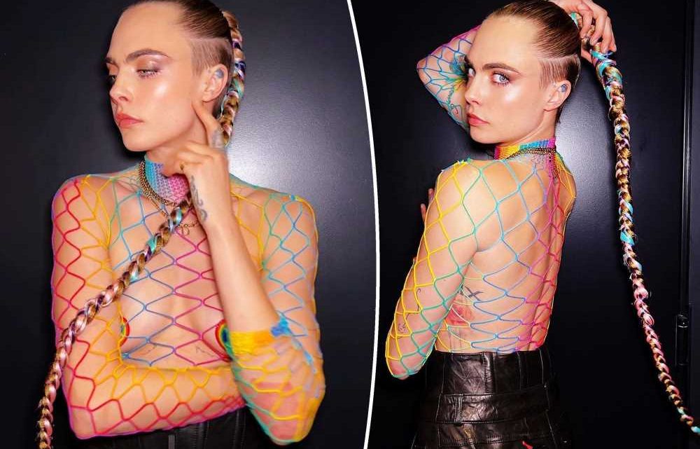 Cara Delevingne is all tied up in mesh top and pasties to celebrate Pride