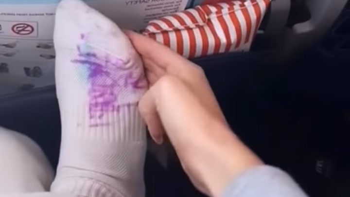 Woman on plane wakes up to find child drawing on her sock & no one's on her side | The Sun