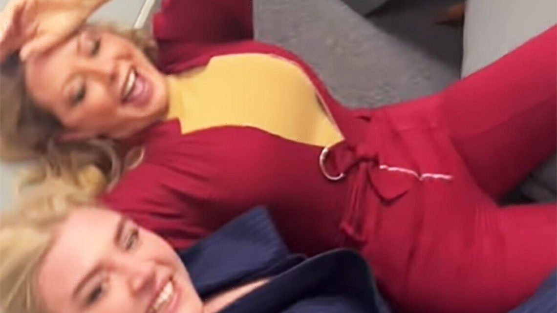 Carol Vorderman in hysterics as she wrestles with pals in jumpsuit