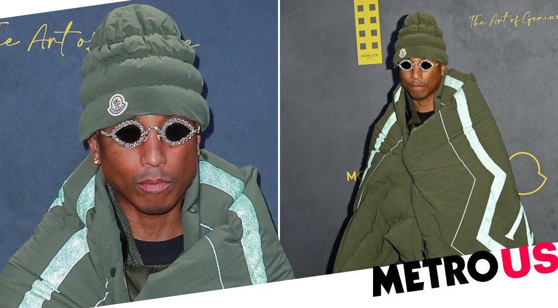 Pharrell Williams rocks sleeping bag chic at LFW and he looks really warm