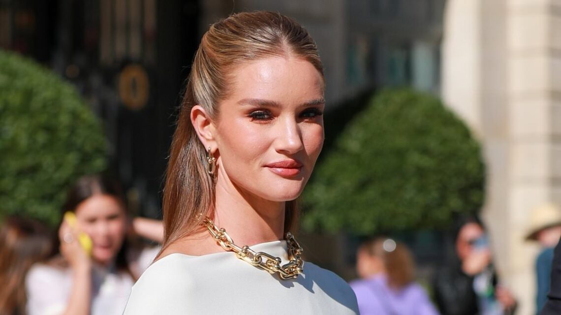Rosie Huntington-Whiteley looks the epitome of chic in a cream cape
